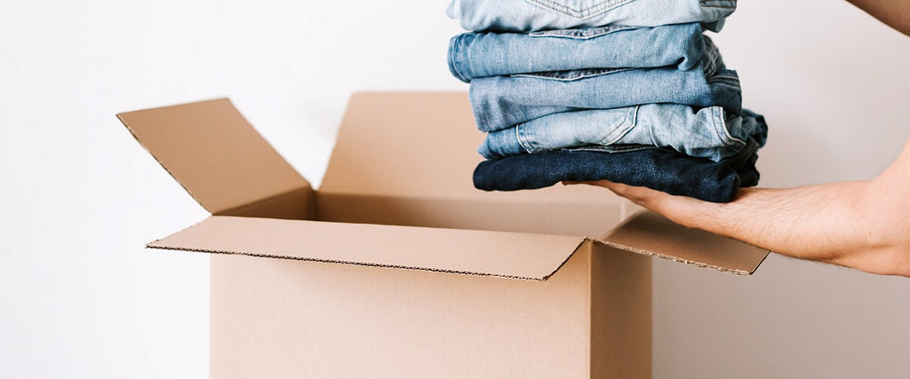 Carton being packed with jeans